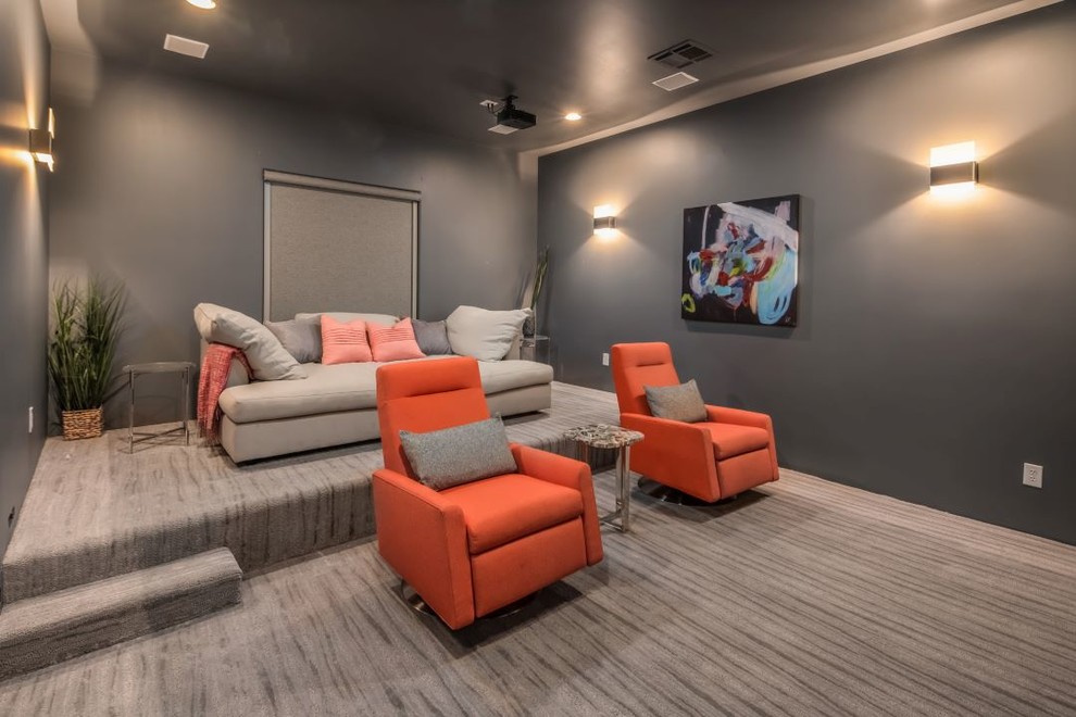 Design ideas for a mid-sized modern enclosed home theatre in Phoenix with grey walls, carpet, a built-in media wall and grey floor.