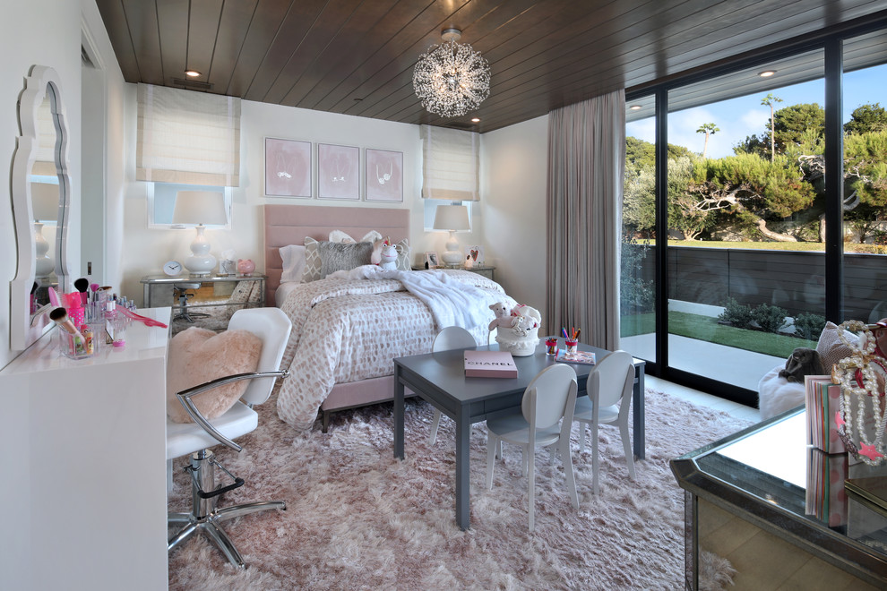 Design ideas for a large contemporary kids' bedroom for kids 4-10 years old and girls in Los Angeles with white walls, carpet and pink floor.