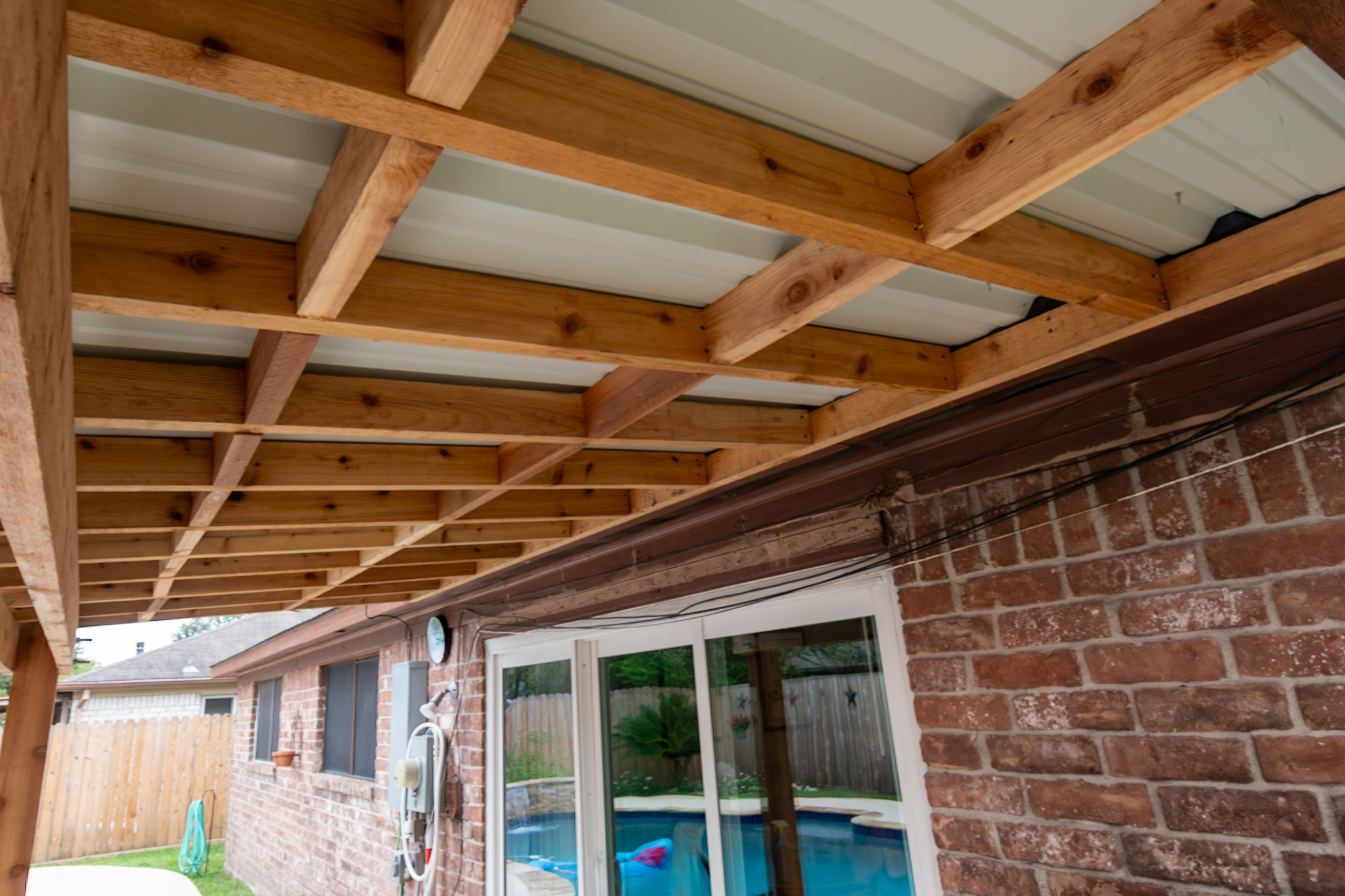 Custom Patio Cover Upgrade – Sealed Cedar & R-Panel Roofin