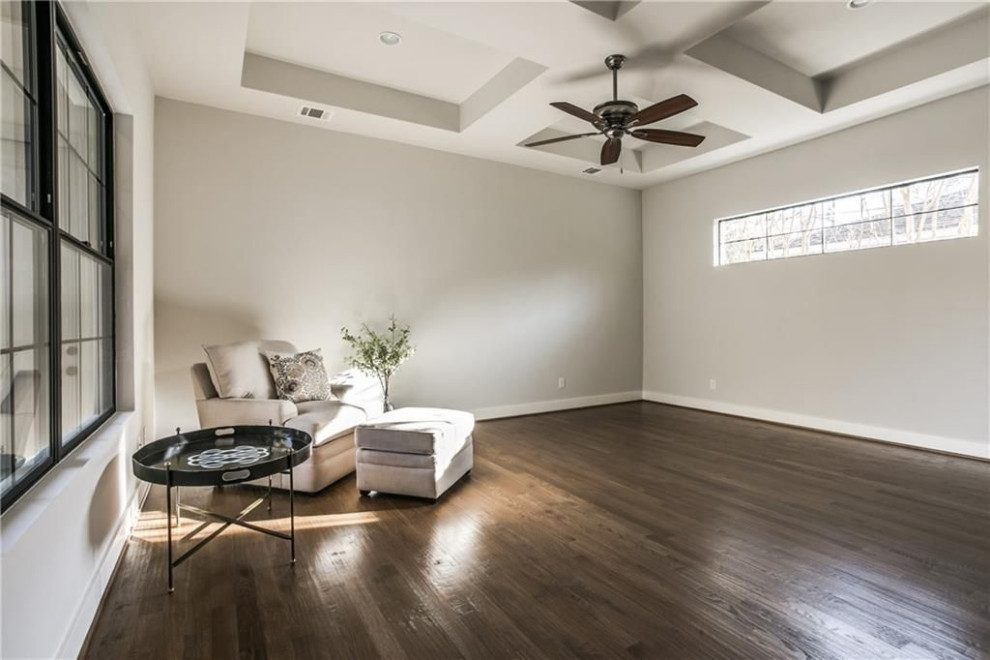 This is an example of a large transitional master bedroom in Dallas with grey walls, medium hardwood floors, no fireplace, brown floor and coffered.