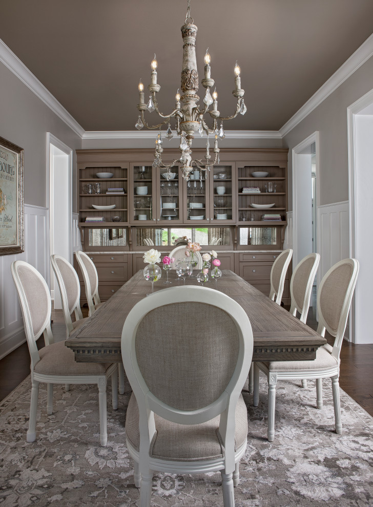 Large transitional separate dining room in Detroit with grey walls, medium hardwood floors and brown floor.