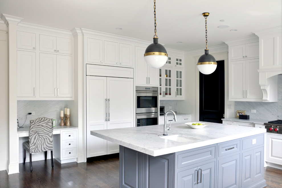 Inspiration for a transitional u-shaped kitchen remodel in Chicago with an undermount sink, recessed-panel cabinets, white backsplash, stone slab backsplash, paneled appliances and white cabinets