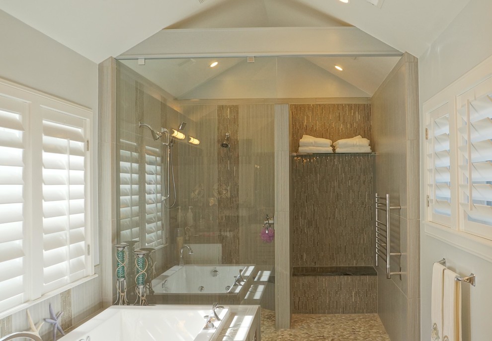 Photo of a large contemporary master bathroom in Denver with shaker cabinets, white cabinets, a drop-in tub, an open shower, a one-piece toilet, beige tile, mosaic tile, white walls, pebble tile floors, a drop-in sink and granite benchtops.