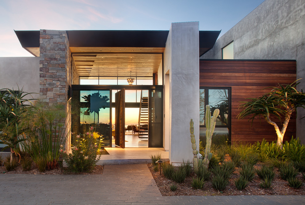 Large modern two-storey grey house exterior in San Diego with mixed siding and a flat roof.
