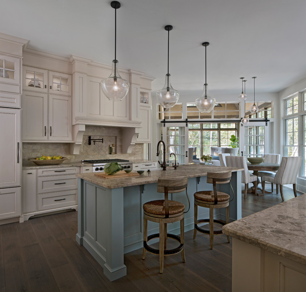 Inspiration for a beach style eat-in kitchen in Detroit with a farmhouse sink, recessed-panel cabinets, beige cabinets, beige splashback, panelled appliances, dark hardwood floors, with island, brown floor and beige benchtop.