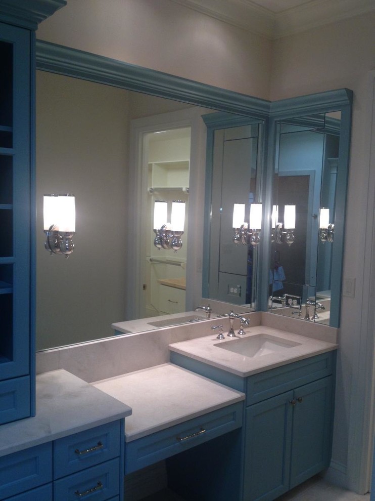 Bathroom - mid-sized transitional 3/4 bathroom idea in Austin with recessed-panel cabinets, blue cabinets and white walls