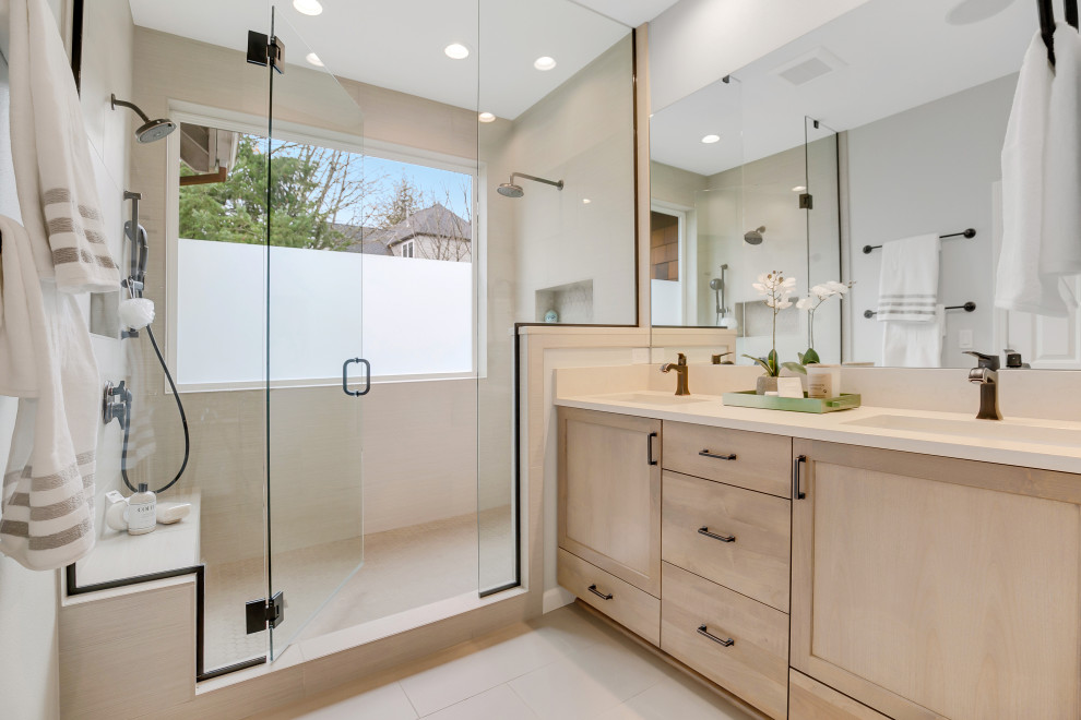Photo of a large contemporary master bathroom in Portland with shaker cabinets, light wood cabinets, a double shower, a bidet, beige tile, ceramic tile, beige walls, ceramic floors, an undermount sink, engineered quartz benchtops, beige floor, a hinged shower door, beige benchtops, a shower seat, a double vanity and a built-in vanity.
