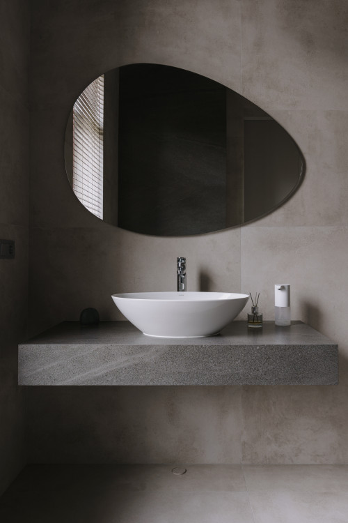 Minimalist Bathroom Design with Vessel Sink Vanity and Chrome Hardware