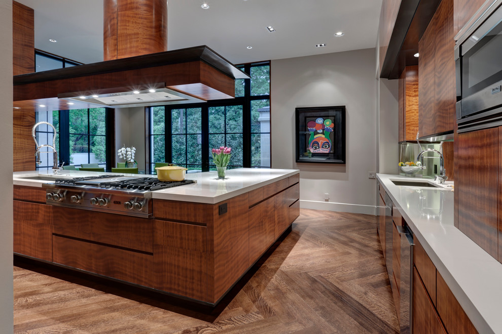 Design ideas for a contemporary kitchen in Dallas with an undermount sink, flat-panel cabinets and medium wood cabinets.