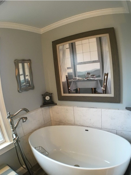Inspiration for a transitional white tile and ceramic tile freestanding bathtub remodel in Detroit with blue walls