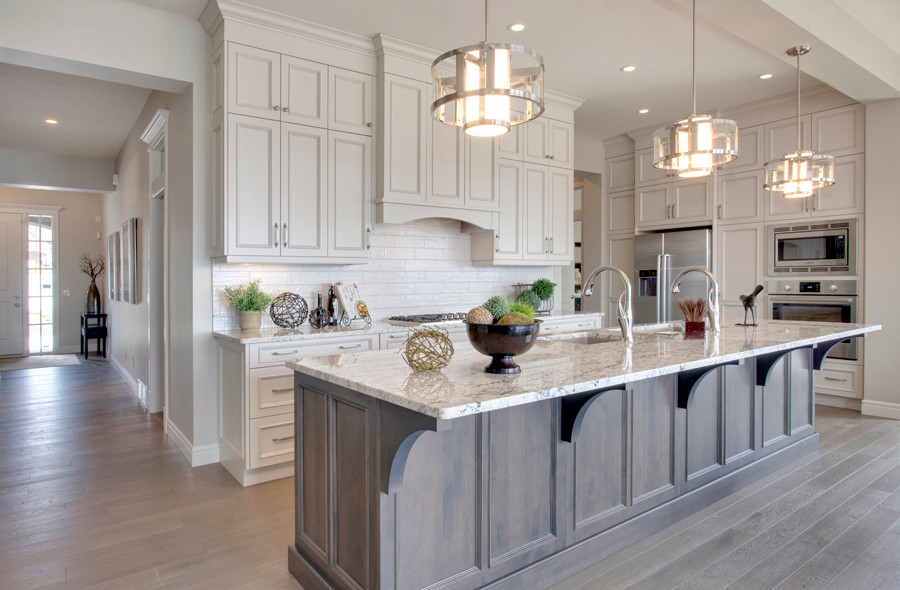 Inspiration for a mid-sized transitional l-shaped light wood floor open concept kitchen remodel in Calgary with an undermount sink, recessed-panel cabinets, dark wood cabinets, granite countertops, white backsplash, ceramic backsplash, stainless steel appliances and an island