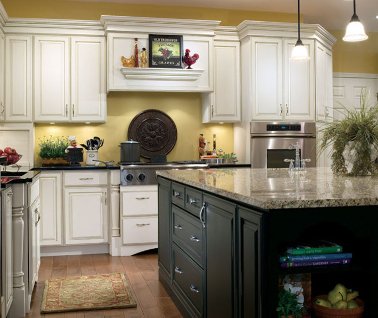 Inspiration for a mid-sized transitional l-shaped brown floor and dark wood floor eat-in kitchen remodel in Orange County with an undermount sink, raised-panel cabinets, white cabinets, granite countertops, beige backsplash, ceramic backsplash, stainless steel appliances and an island