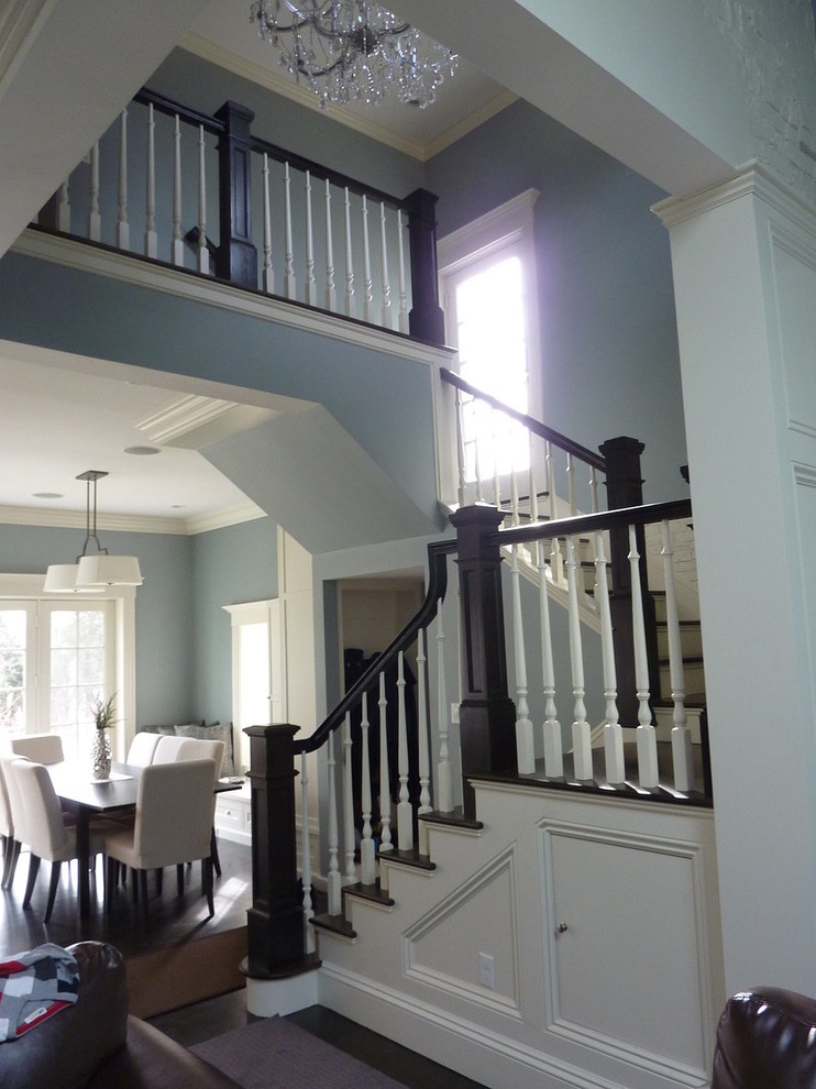 Design ideas for a large contemporary wood curved staircase in Boston with wood risers.