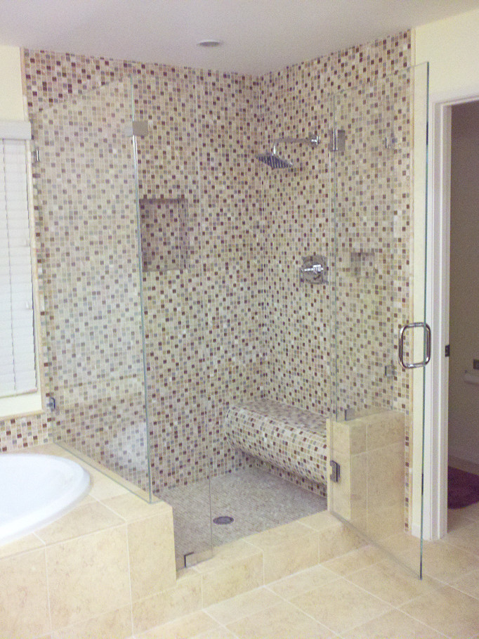 Photo of a mid-sized transitional master bathroom in Orange County with a drop-in tub, an alcove shower, multi-coloured tile, mosaic tile, yellow walls, porcelain floors, beige floor and a hinged shower door.
