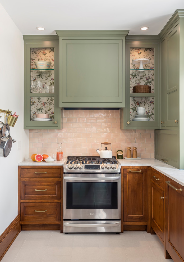 This is an example of a mid-sized eclectic galley separate kitchen in Minneapolis with a farmhouse sink, flat-panel cabinets, green cabinets, marble benchtops, pink splashback, ceramic splashback, stainless steel appliances, porcelain floors, beige floor and grey benchtop.