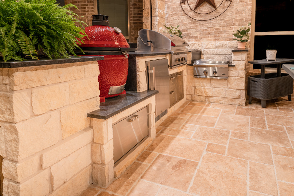 Patio kitchen - mid-sized transitional backyard stone patio kitchen idea in Dallas with a roof extension