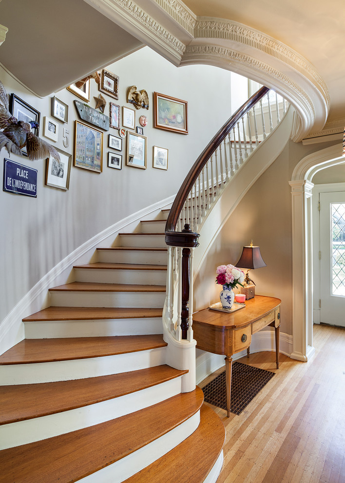 Design ideas for a traditional wood curved staircase in Portland.