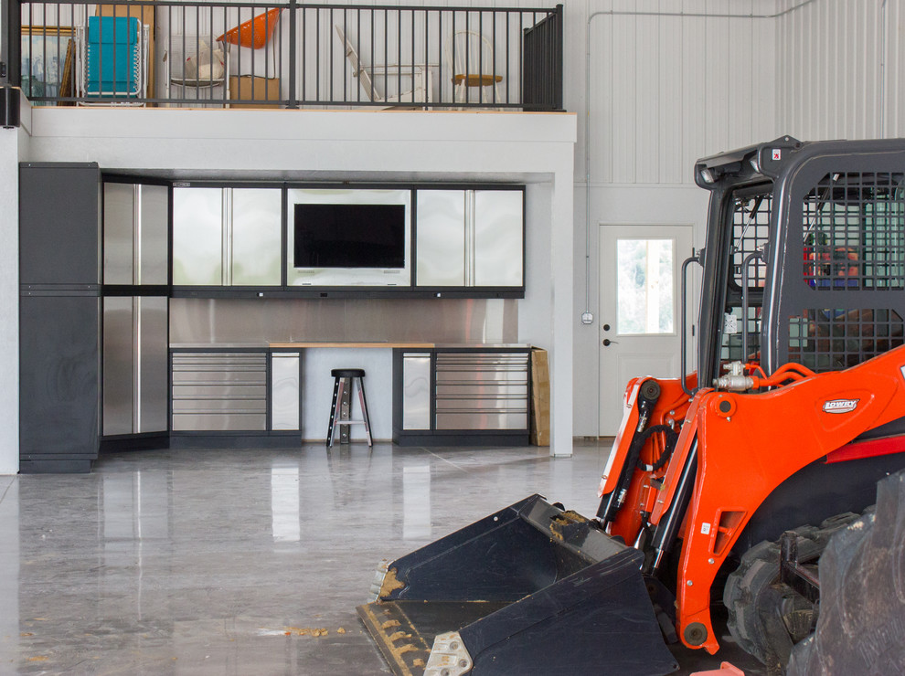 Garage - huge rustic attached garage idea in Cedar Rapids