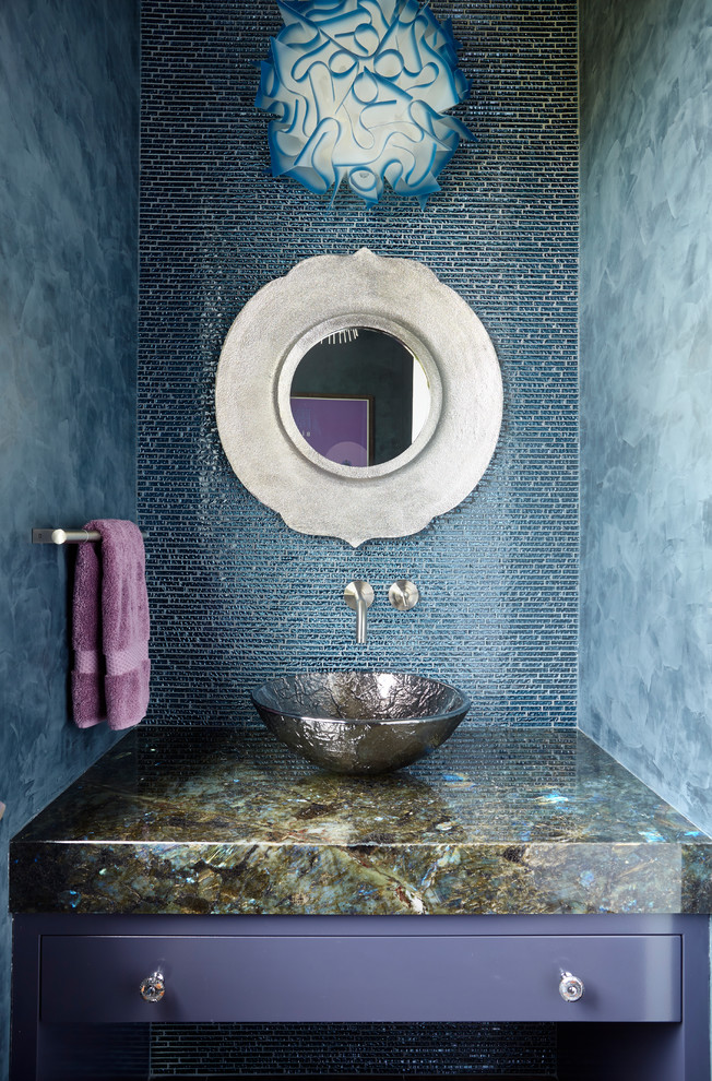 Design ideas for an eclectic powder room in New York with purple cabinets, blue tile, blue walls, a vessel sink and multi-coloured benchtops.