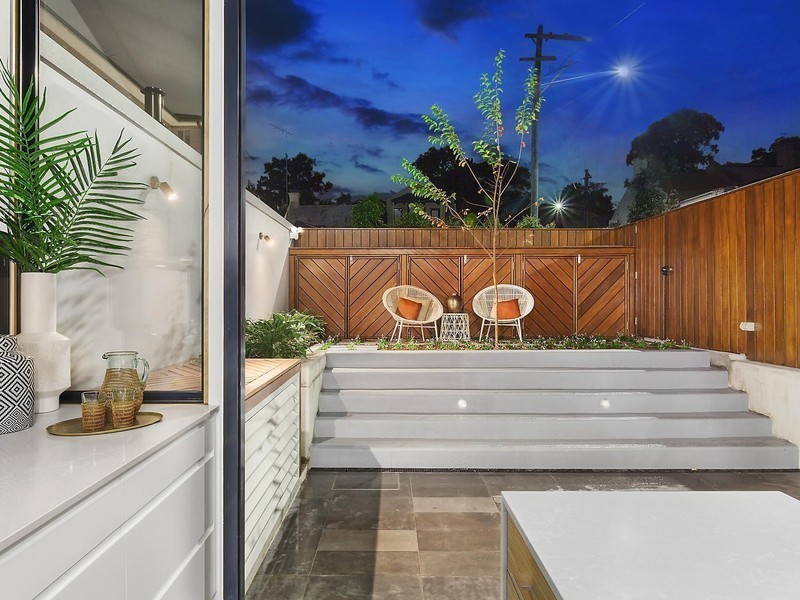 This is an example of a small contemporary backyard patio in Other with concrete pavers and no cover.