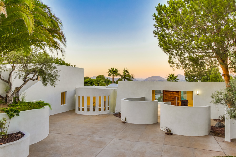 Inspiration for a contemporary white one-story flat roof remodel in San Diego