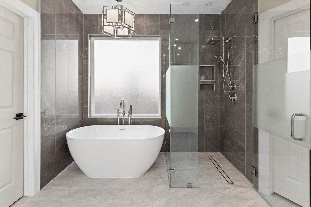 This is an example of a medium sized classic ensuite bathroom in Houston with beaded cabinets, white cabinets, a freestanding bath, a built-in shower, grey tiles, ceramic tiles, grey walls, ceramic flooring, a submerged sink, engineered stone worktops, white floors, a hinged door, white worktops, double sinks and a built in vanity unit.