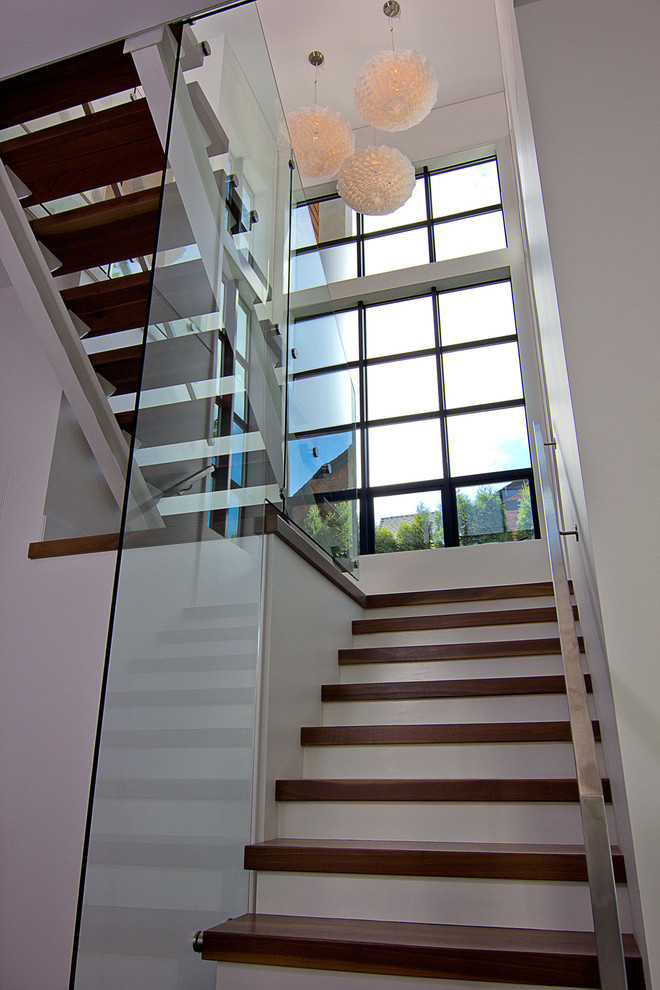 This is an example of a contemporary wood staircase in Vancouver.