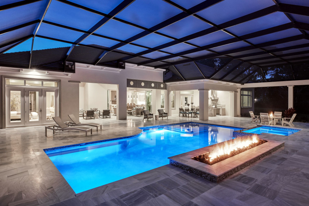 Inspiration for a huge transitional backyard stone and rectangular natural hot tub remodel in Miami