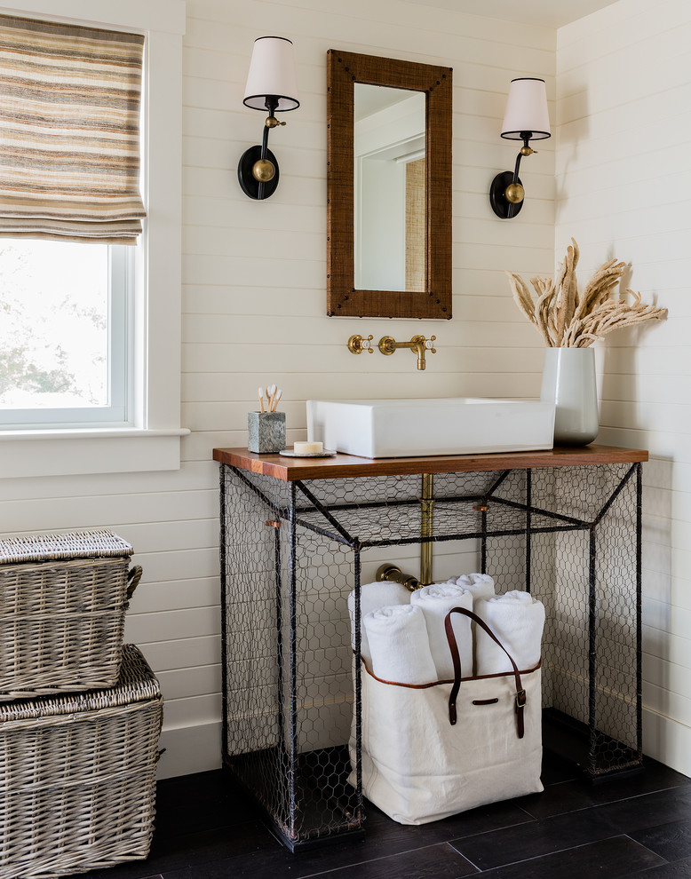 This is an example of a mid-sized beach style master bathroom in Other with white walls, slate floors, a vessel sink, wood benchtops and brown benchtops.