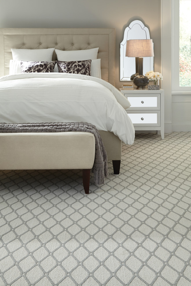 Inspiration for a large transitional master bedroom in New York with grey walls and carpet.