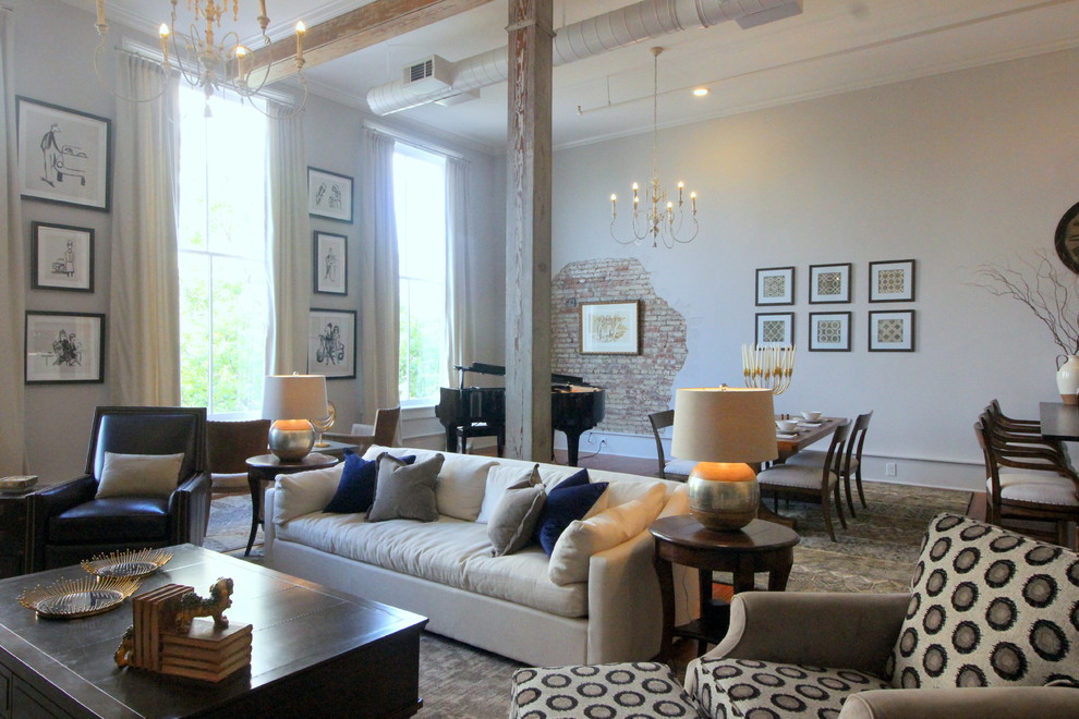 Inspiration for a mid-sized industrial loft-style medium tone wood floor and brown floor living room remodel in Atlanta with a music area, gray walls and no fireplace