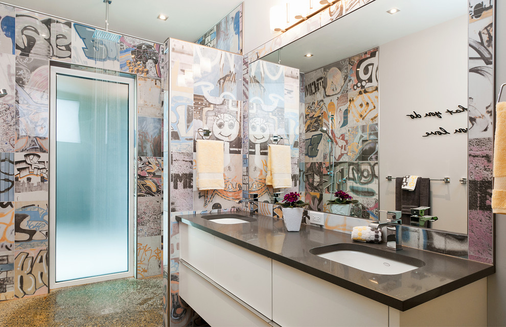 Inspiration for a mid-sized contemporary master bathroom in Vancouver with an undermount sink, flat-panel cabinets, white cabinets, solid surface benchtops, an open shower, multi-coloured tile, ceramic tile, multi-coloured walls and concrete floors.