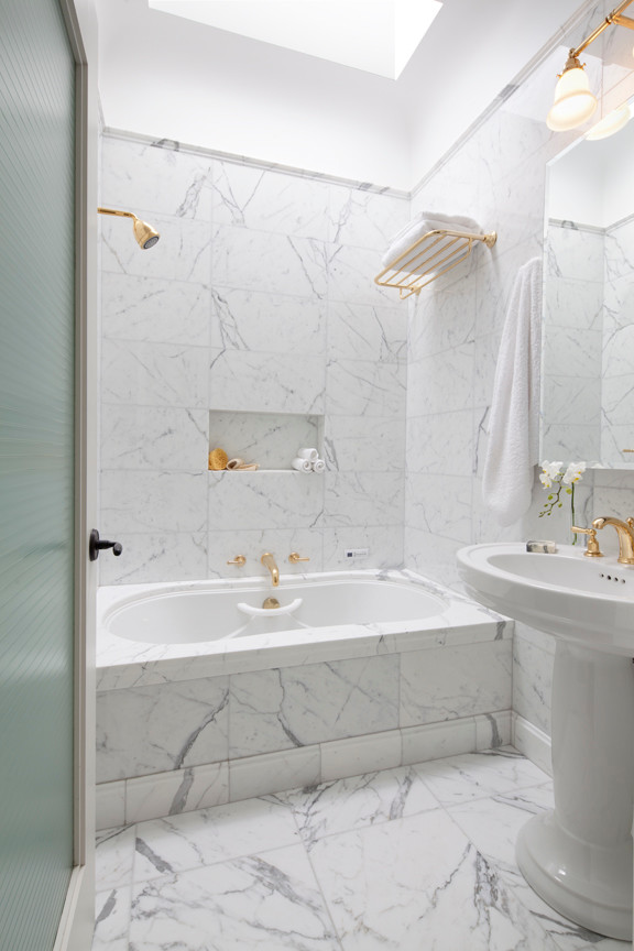 Design ideas for a mid-sized transitional master bathroom in San Francisco with an alcove tub, a shower/bathtub combo, gray tile, white tile, stone tile, white walls, marble floors, a pedestal sink and solid surface benchtops.
