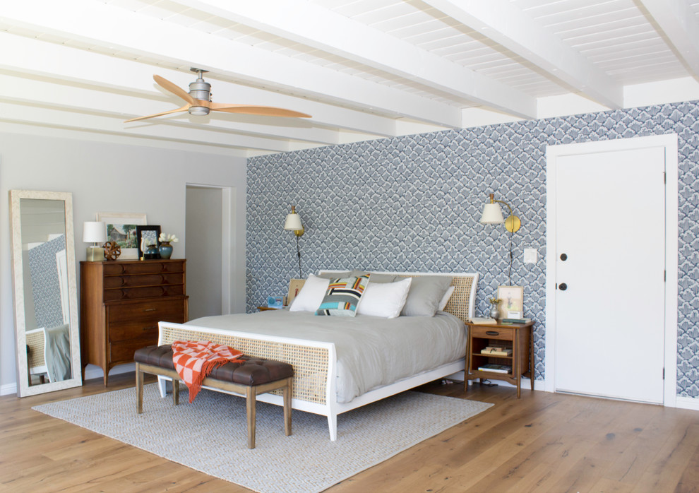 Design ideas for a large midcentury master bedroom in San Diego with blue walls, medium hardwood floors and no fireplace.