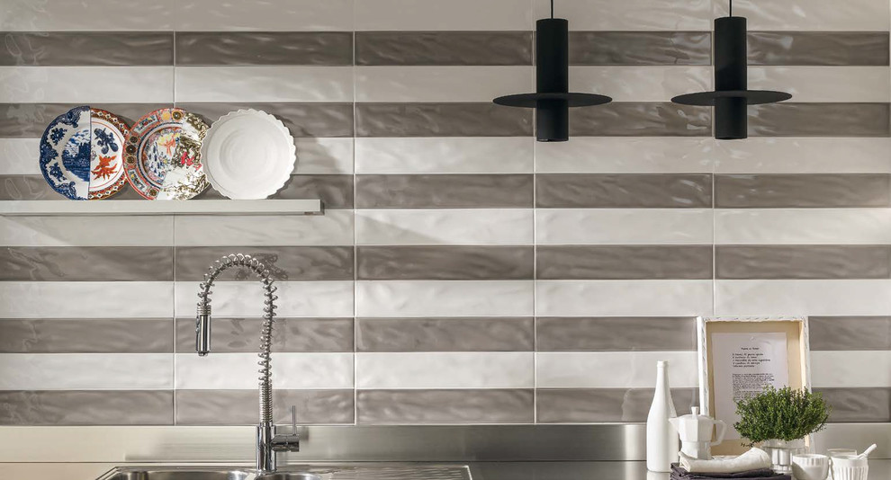 Inspiration for a transitional ceramic tile and gray floor kitchen remodel with medium tone wood cabinets, wood countertops, white backsplash, stone tile backsplash and stainless steel appliances