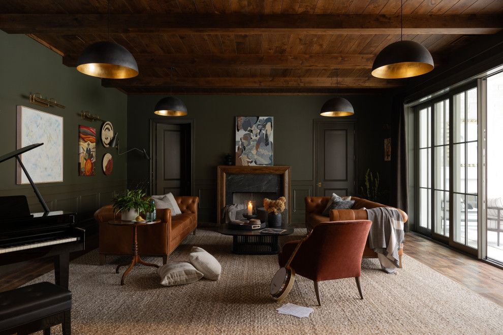 Example of a transitional enclosed dark wood floor, brown floor, exposed beam and wood ceiling living room design in Nashville with green walls and a standard fireplace