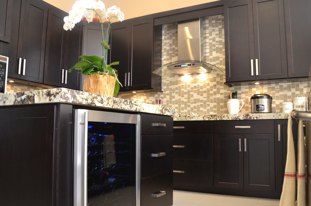 Large transitional u-shaped porcelain tile open concept kitchen photo in Miami with an undermount sink, shaker cabinets, dark wood cabinets, granite countertops, multicolored backsplash, mosaic tile backsplash, stainless steel appliances and an island