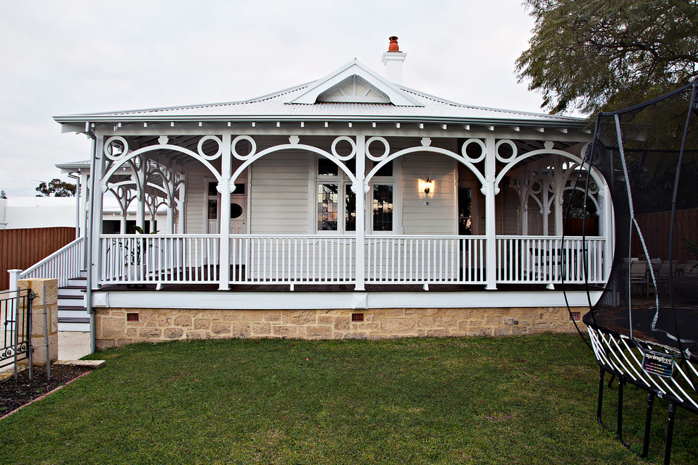 Design ideas for a traditional two-storey white house exterior in Perth with wood siding, a hip roof and a metal roof.