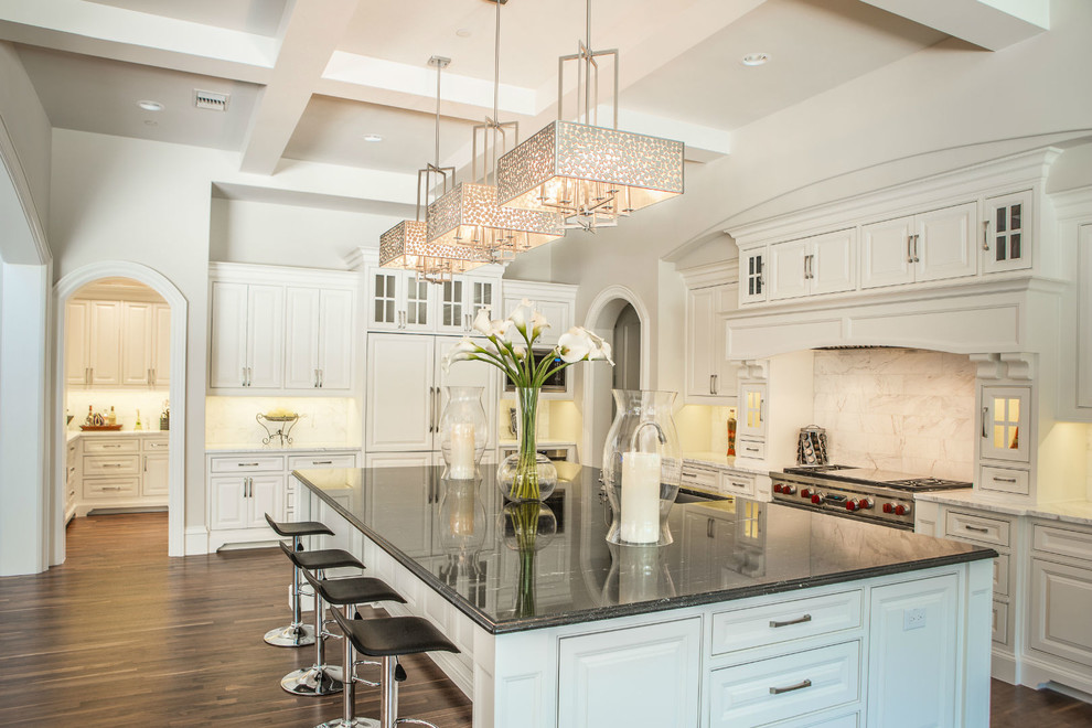 Photo of a large traditional l-shaped kitchen in Baltimore with an undermount sink, beaded inset cabinets, white cabinets, dark hardwood floors and with island.