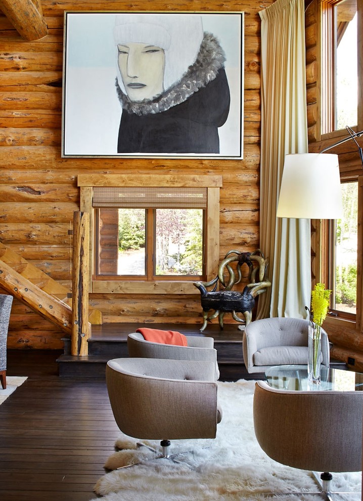 Example of a mountain style open concept dark wood floor living room design in Denver