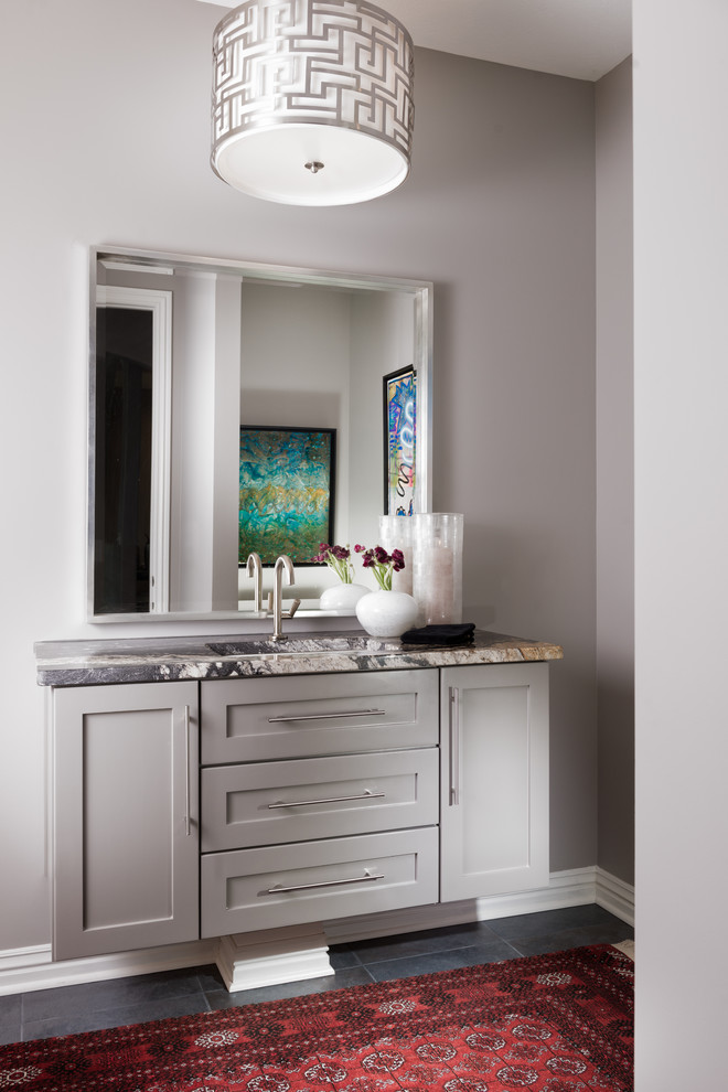 Example of a small transitional 3/4 bathroom design with shaker cabinets, gray cabinets, an undermount sink and granite countertops