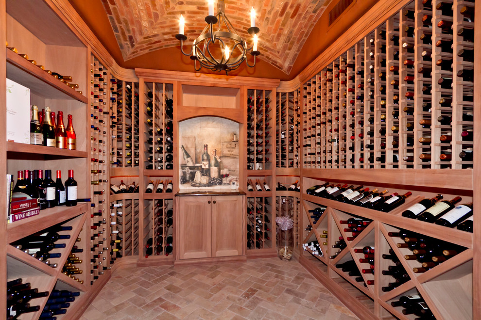 Mediterranean wine cellar in Phoenix with brick floors.