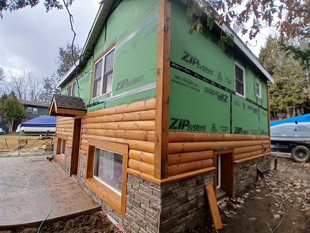 Log Siding, Stamped Concrete and Post and Beam Carport