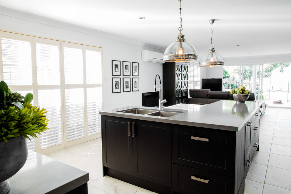 Design ideas for a small modern l-shaped open plan kitchen in Central Coast with a double-bowl sink, glass-front cabinets, black cabinets, quartz benchtops, white splashback, stone slab splashback, stainless steel appliances, ceramic floors, with island and grey floor.