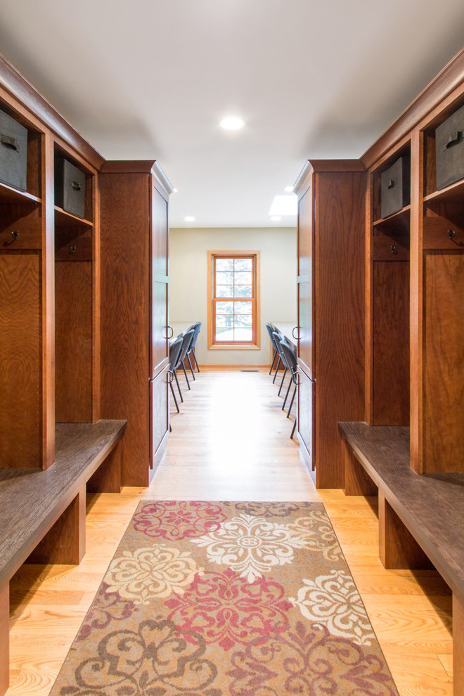 Design ideas for a mid-sized traditional mudroom in Milwaukee with beige walls, light hardwood floors and beige floor.