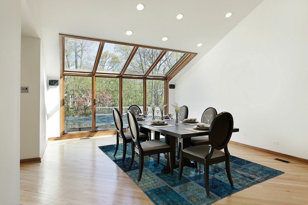 Mid-sized transitional light wood floor and beige floor enclosed dining room photo in Baltimore with white walls and no fireplace