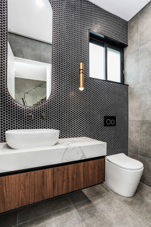 Bold Black Hexagon Tile Bathroom with Marble Accents