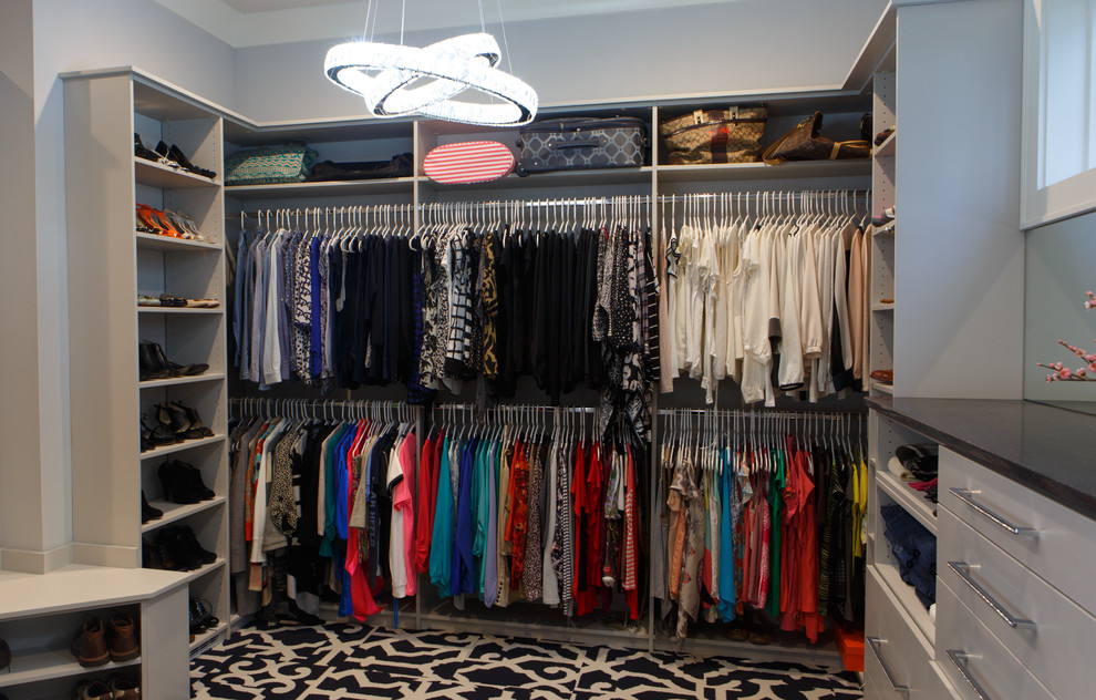 Photo of a modern women's walk-in wardrobe in Charlotte with open cabinets, carpet and multi-coloured floor.