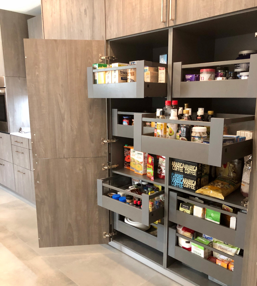 Transitional kitchen pantry in Houston with flat-panel cabinets, white cabinets, grey splashback, porcelain splashback, porcelain floors, grey floor and yellow benchtop.