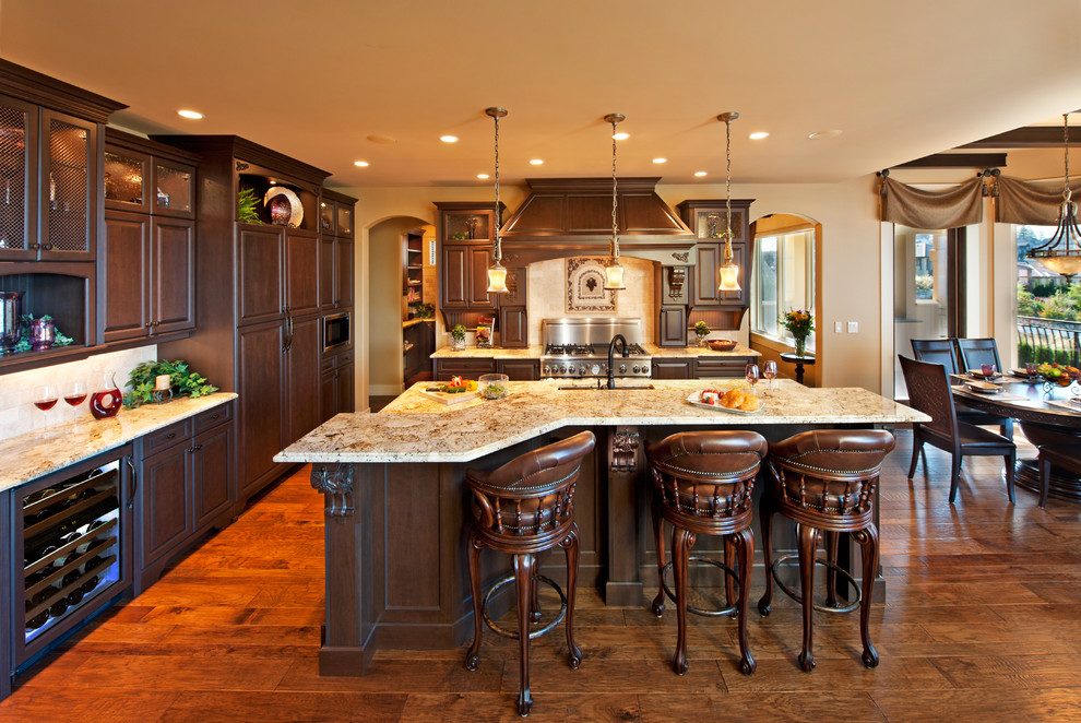 This is an example of a traditional kitchen in Vancouver with granite benchtops.